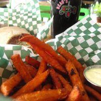 Organic beer on tap, sweet potatoe fries with chipotle mayo and a sandwich at Panthere Verte - Mile End in Montreal