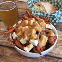 Poutine, beer, and the classic falafel sandwich! at Panthere Verte - Mile End in Montreal