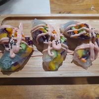 Rice skins encasing cucumber, pepper, red cabbage and mango - delicious. 
Vegetarian. Could be vegan without sauce. 

Around 20-25rmb. at WángYǔYān Sù Fāng 王语嫣素坊 in Dali