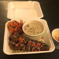 Kebab platter, hummus, rice, pita, salad at Ember Lounge in Calgary