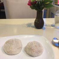 Mochi - stuffed with peanuts, sesame seeds, and coconut.  at Loving Hut in Paris