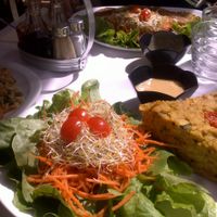 Quiche with salad and dressing and rice and peas at Loving Hut in Paris