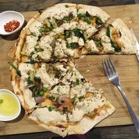 Vegan cheese pizza with peas, broccoli and spinach at Little Windows in Pokhara