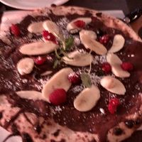 Blurry photo of their nice vegan “nutella pizza"  at Pazzi in Stockholm
