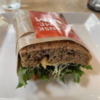 Vegan sandwich: hummus, sun dried tomato, avocado and olive  at Godt Brød in Stavanger