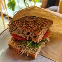 Vegan sandwich: Hummus, sundried tomatoes, olives, paprika, lettuce and tomato. at Godt Brød in Stavanger