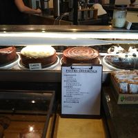 Cake selection and various granola bars at the desk front at Dessert Oasis Coffee Roasters in Detroit