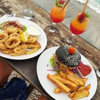 Tempeh Burger and The Golden Hour Cocktail at Penida Colada Beach Bar in Penida Island