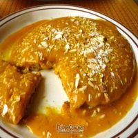 Cardamom flavored pancakes with mango puree and slivered almonds on top...Yum! at Annapurna's World Vegetarian Cafe - 4th St in Albuquerque