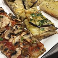 Mushroom, eggplant (so good!), and potato pizzas  at Alice in Lucca