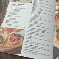 You see the sign V in every vegan dish. Very tasty vegan options!! at Garlic Grill House in Samos