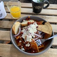 Chilaquiles rojos con chorizo, jugo de naranja y te de menta  at Café Vegetal in Mexico City