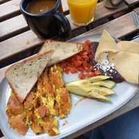 Scrambled tofu with ham, Avocado, Tomato, Bread, Frijoles & Chips at Café Vegetal in Mexico City