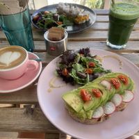 Avocado toast and sweet potato hummus with vegan feta. Superfood juice and oat flat white   at Sugar Rabbit Kaffé in Albufeira