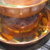 Cooking vegetables in the hotpot at Yangege 焱格格蔬食料理火锅 in Shanghai