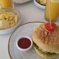 Vegan burger with chips and ketchup at Dom Chá in Guimaraes
