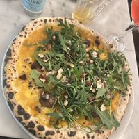 Pumpkin base with mushrooms, hazelnut, beetroot & rocket  at NONA Pizza in Brussels