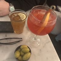Ice tea, virgin pink spritz, fresh organic olives  at NONA Pizza in Brussels