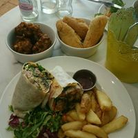 Jerk burrito wrap. With extra corn fritters and Festivals (Like savory donut sticks) at Mama Fay's in Aberystwyth