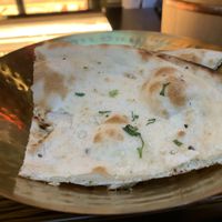Bread served at start of meal. If you don’t want it tell them or you’ll be charged. It was good but tell them vegan so it doesn’t have butter.  at JNcQUOI Asia in Lisbon