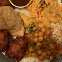 Delicious takeout feast including Chana Masala and Vegetable Korma!  at New Paltz Indian Restaurant in New Paltz
