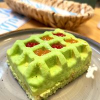 Vegan Pistachio cake: puffed rice, vegetable cream, pistachio sauce, cocoa velor, raspberry and peach jam. at Garun in Yerevan
