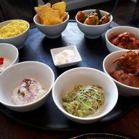 30 EUR "a bit of everything" - menu:
i.e. 8 samples, of which one is rice and one is nachos... at Green House  in Brussels