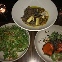 Arugula salad, heart of palm cakes, massaman curry at Plonk in Bozeman