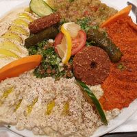 Meze, with hummus, aubergine puree, pepper puree, falafel, tabbouleh etc. at Midan in Stockholm