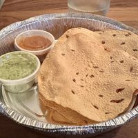 Pappadam with fire roasted tomato chutney(nice heat) cilantro sauce(nice spiciness and verifies with kitchen it’s vegan)  at Utara Brewing Co in Sandpoint