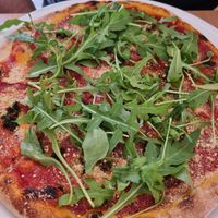 Pizza with pesto and cashew cheese at Napfényes Restaurant & Confectionery in Budapest