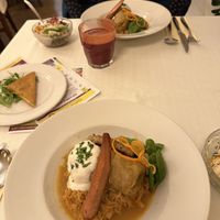 Stuffed cabbage, salad bowls and vegan cheese  at Napfényes Restaurant & Confectionery in Budapest