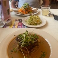 Teriyaki tofu on rice.  Middle is home made cabbage.  Far side of the photo is a raw plate.  All really good.    at Napfényes Restaurant & Confectionery in Budapest