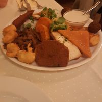 Lavish platter for 2. The brown soy patty at the front is as big as my hand! at Napfényes Restaurant & Confectionery in Budapest