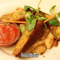 Fried Pancakes Filled with Vegetable Cream served with Mashed Potatoes and Onions at Napfényes Restaurant & Confectionery in Budapest