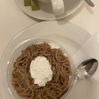 Local dessert- looks weird but tastes good. Mild but earthy. This is chestnut purée with whipped creamm  at Napfényes Restaurant & Confectionery in Budapest