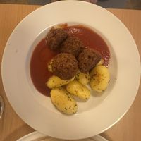 Veg Balls, tomato sauce and potatoes   at Napfényes Restaurant & Confectionery in Budapest