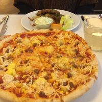 Pizzas are huge! at Napfényes Restaurant & Confectionery in Budapest