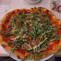 Pizza with cashew parmesan at Napfényes Restaurant & Confectionery in Budapest