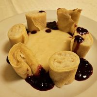 Rice pudding crepes with berry sauce at Napfényes Restaurant & Confectionery in Budapest