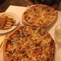 Pizzas, steak fries and breaded fried cheese at Napfényes Restaurant & Confectionery in Budapest