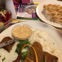 Stuffed breaded seitan kiev with thousands islands dressing; smashed potatoes at Napfényes Restaurant & Confectionery in Budapest