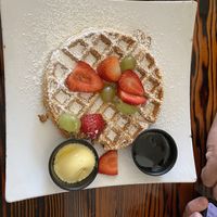 Delicious sweet potato waffle, tofu scramble, “sausage” , fresh fruit. Yum!   at Souley Vegan in Oakland