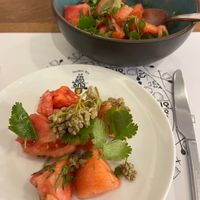 Tomato salad with pickled jonjoli (buds of caucasian bladdernut), herbs, and Kakhetian sunflower seed oil. at Salobie Bia in Tbilisi
