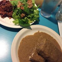 Southern fried seitan with gravy, Caesar salad, and bbq jackfruit at Counter Culture in Austin