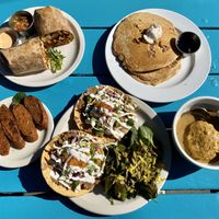 Breakfast burrito, apple crisp pancakes, sausage, tostadas and biscuits and gravy. at Counter Culture in Austin