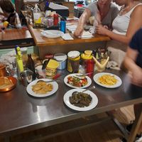 Insalata greca, foglie di vite ripiene di riso, cipolle ripiene e patate fritte homemade   at Ta Platania in Kastellorizo