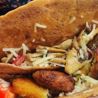 Crepe with vegan cheese, mushrooms, zucchini croquettes, tomato at Navarino Creperie in Thessaloniki