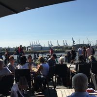 Outdoor seating with the view on the harbour at ALEX in Hamburg
