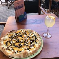 Mushroom and truffle pizza. Kombucha drink.  at Blu Bar in Barcelona